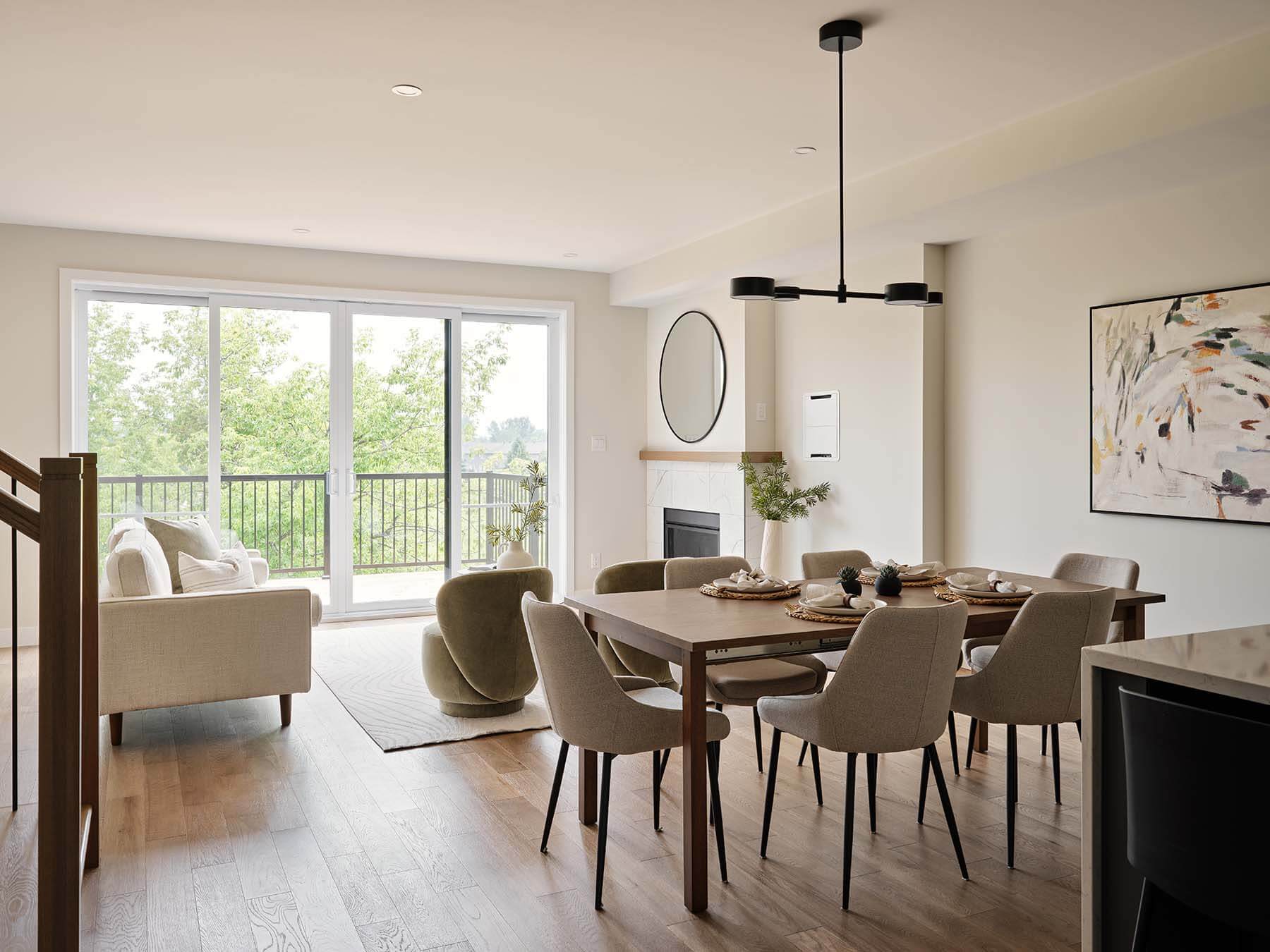 Open-concept dining and living area with fireplace and patio doors