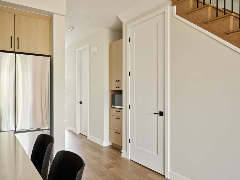 Kitchen hallway with built-in storage and staircase