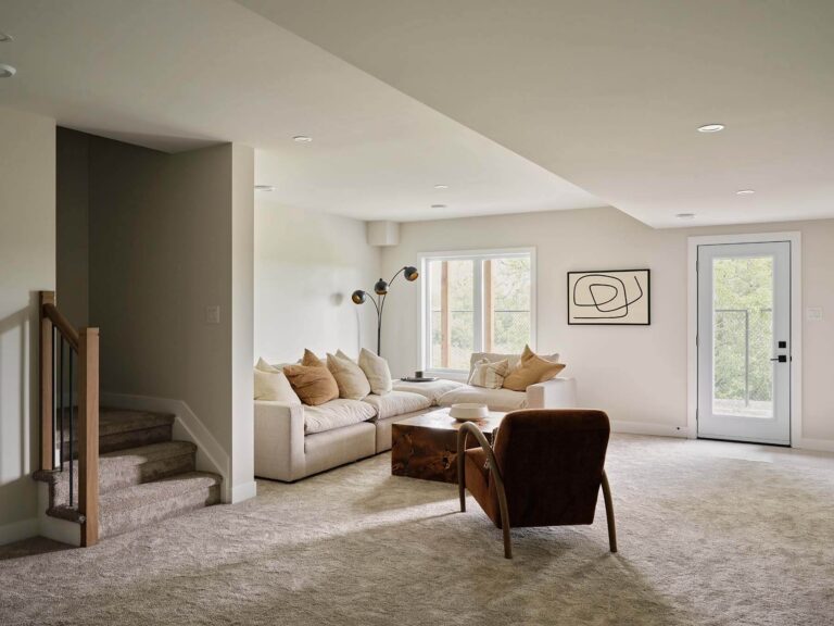 Finished lower-level family room with sectional sofa