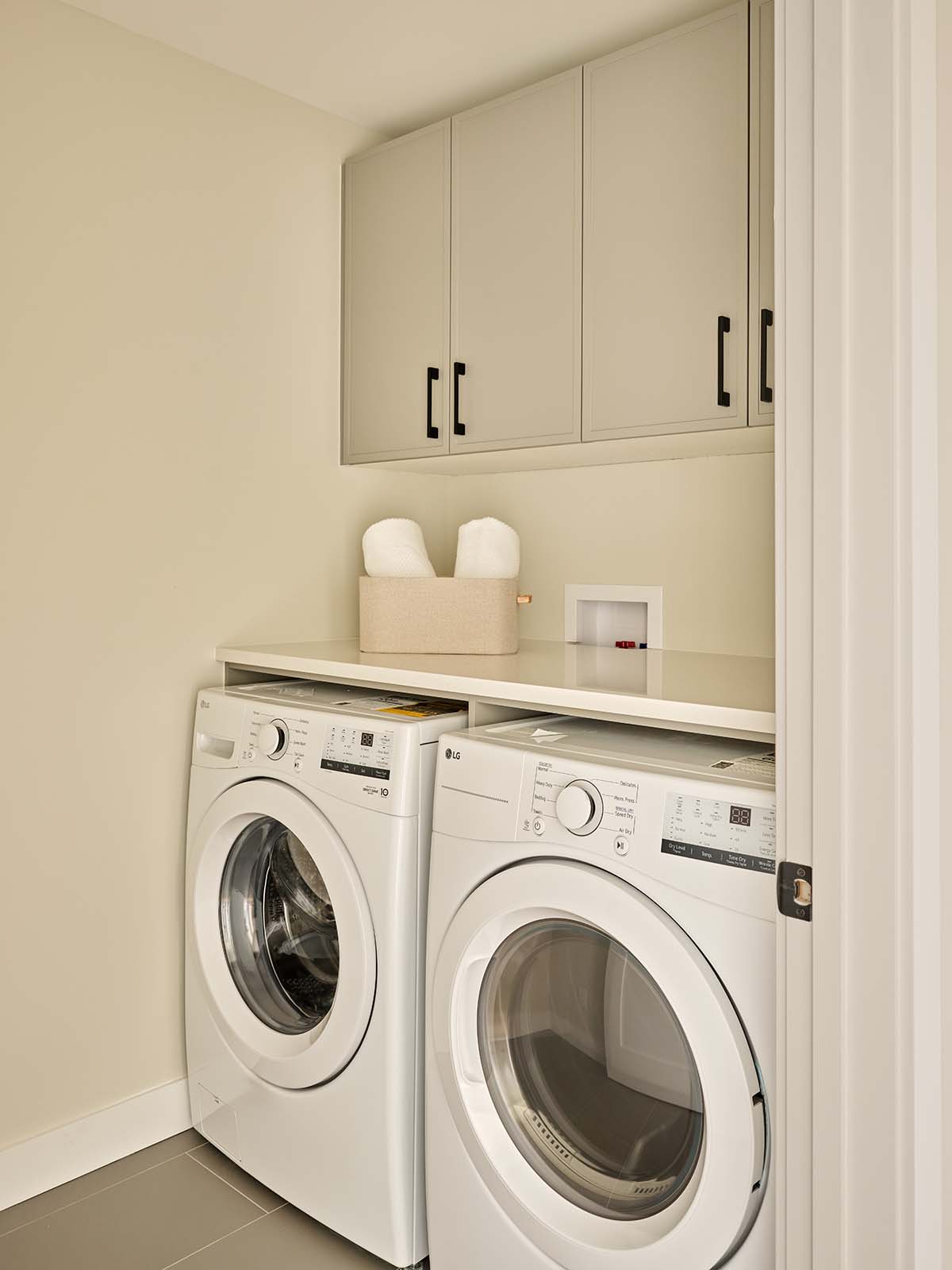 Laundry room with side-by-side washer and dryer