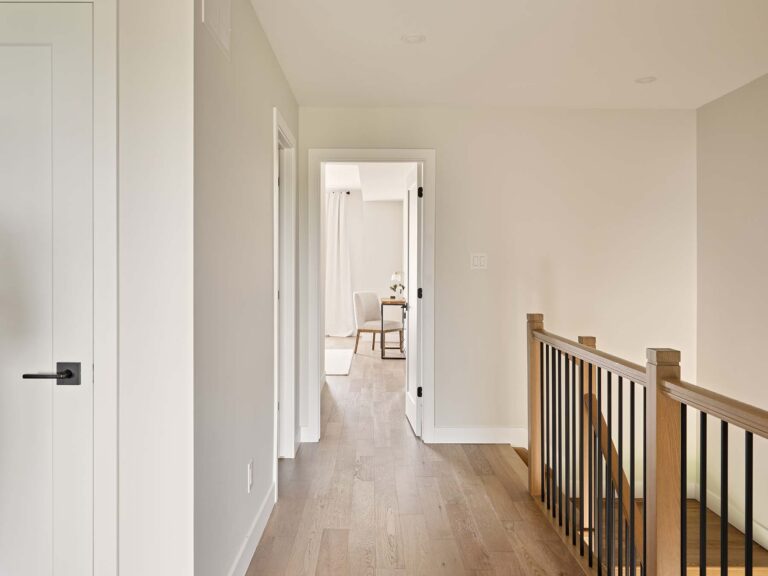 Upper hallway with wood railing