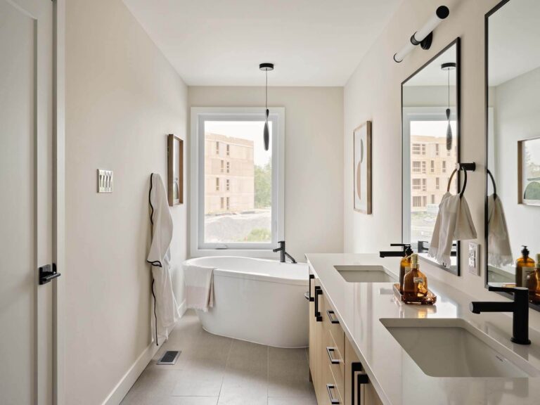 Ensuite bathroom with double vanity and freestanding tub