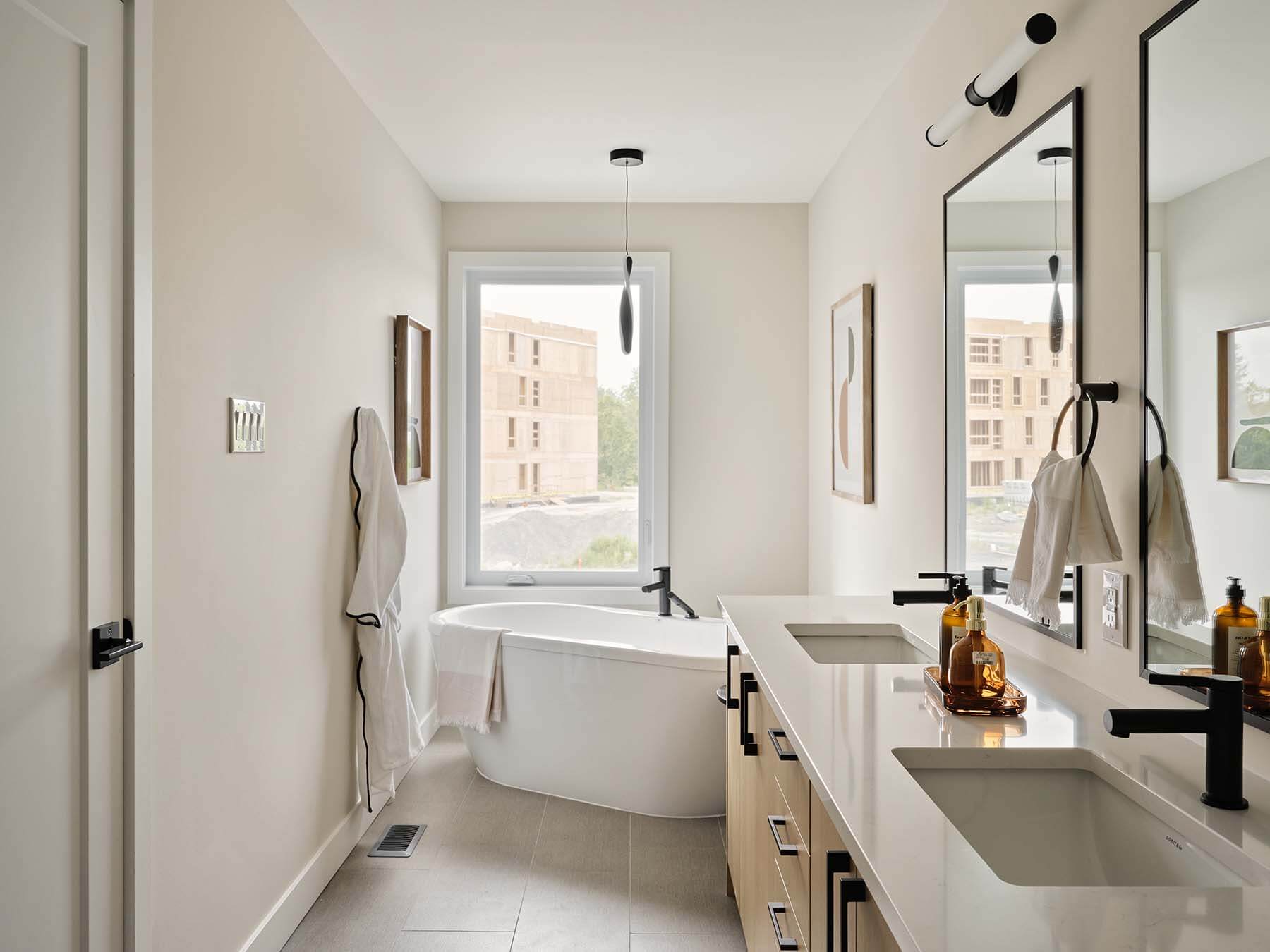 Ensuite bathroom with double vanity and freestanding tub