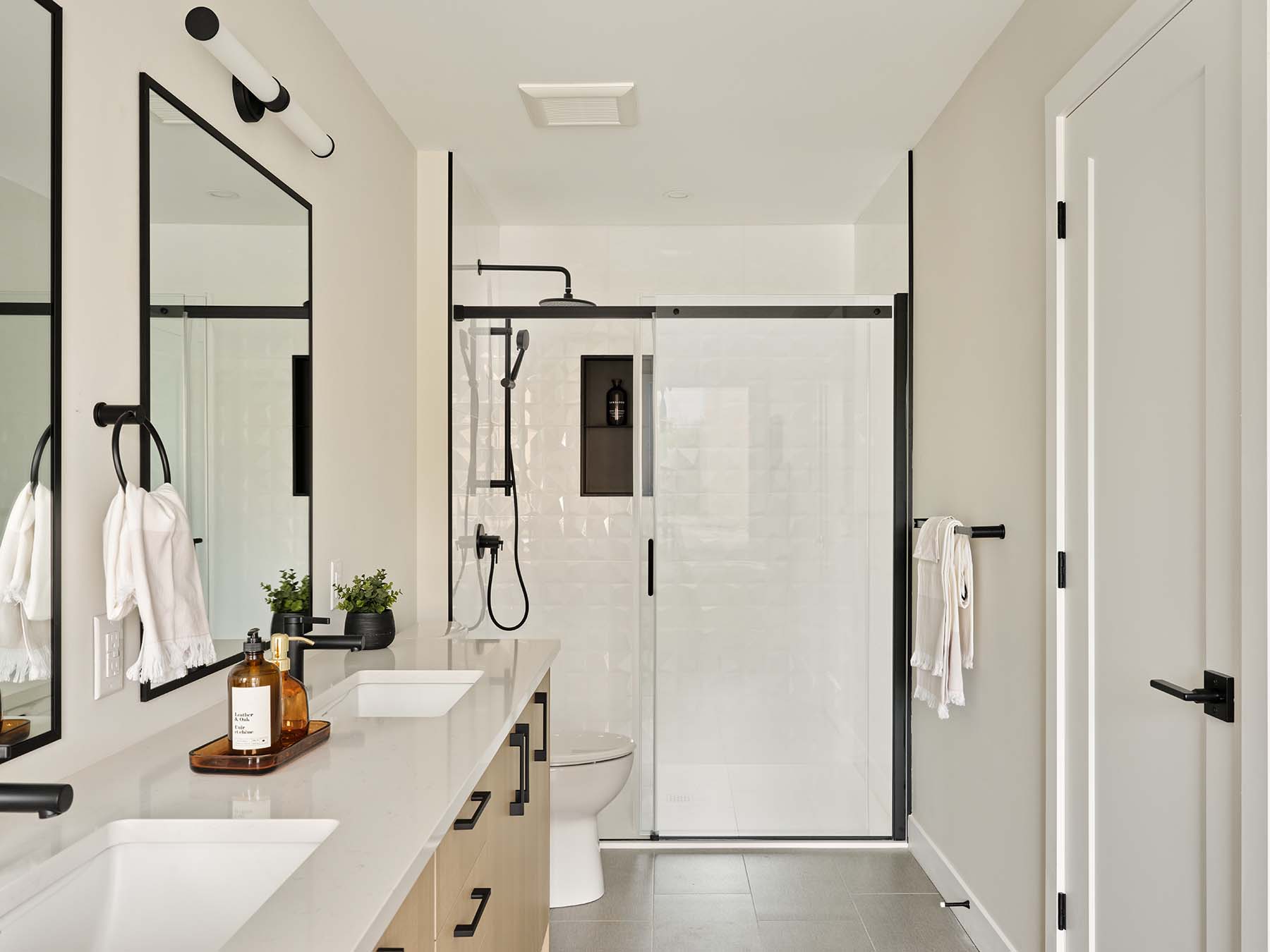 Ensuite bathroom with glass shower and double vanity