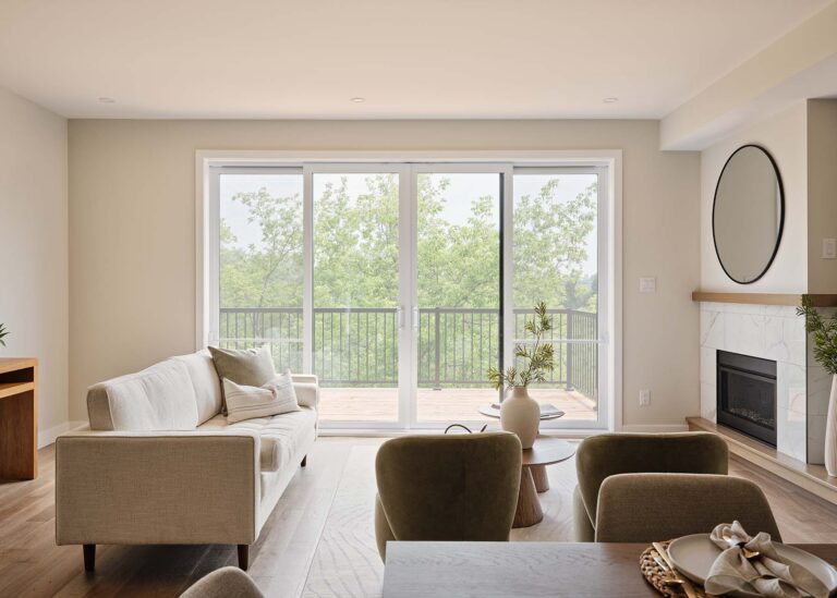 Bright living room with patio doors and fireplace